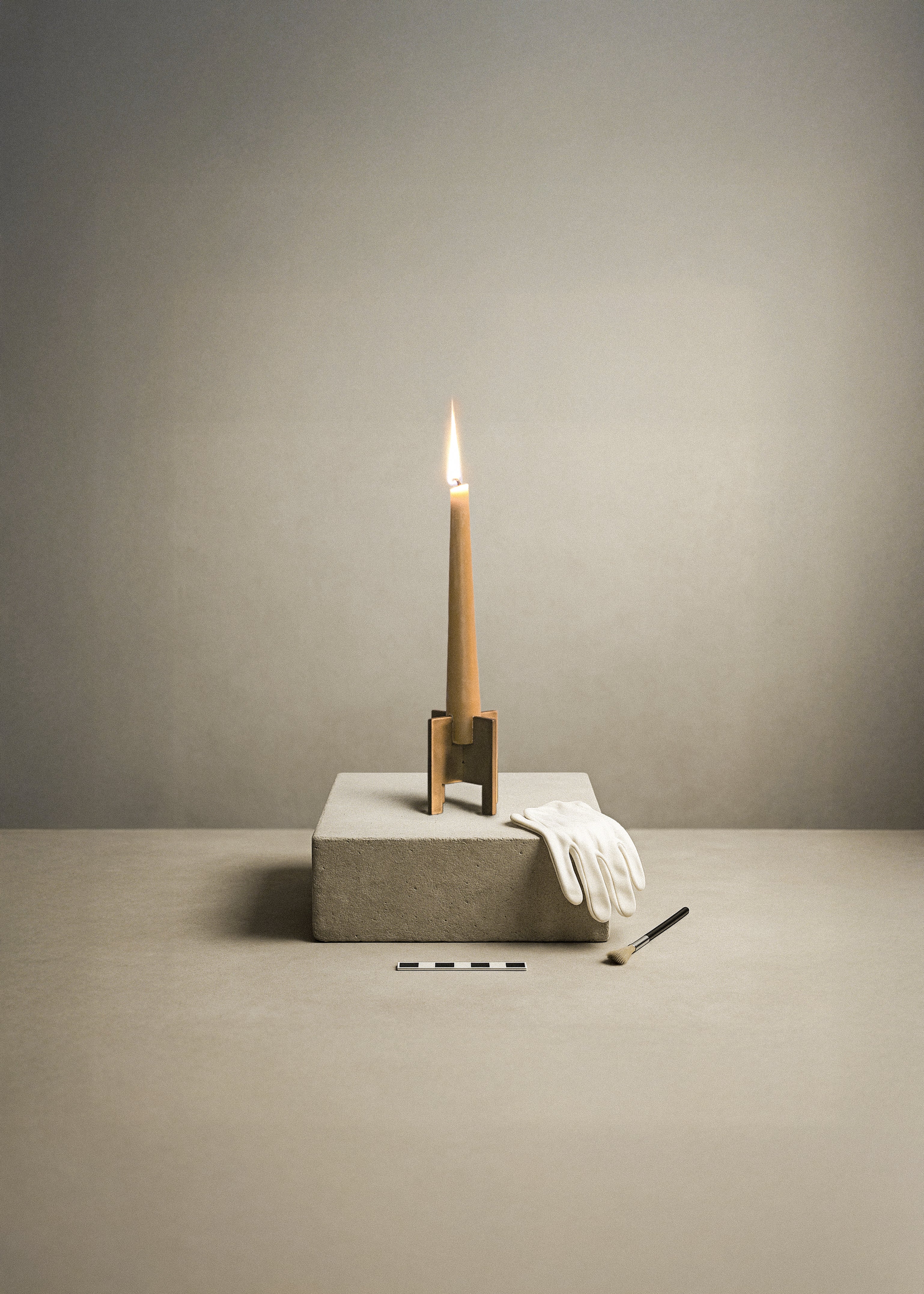 A calm archeological scenery of a brass Lyssier candle holder holding a burning beeswax candle while standing on a podest from natural stone. Besides lays a glove and a brush, as well as a ruler which lays in front.